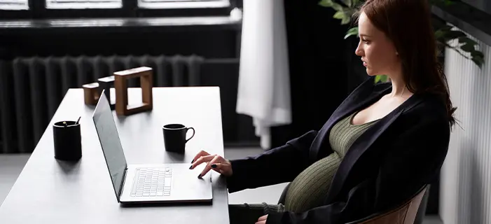 a pregnant woman, highlighting the theme of pregnancy and disability discrimination in the workplace.